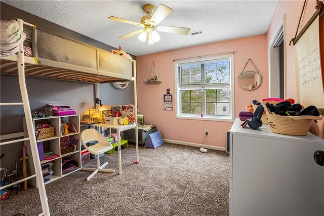a room with furniture a chandelier and a window