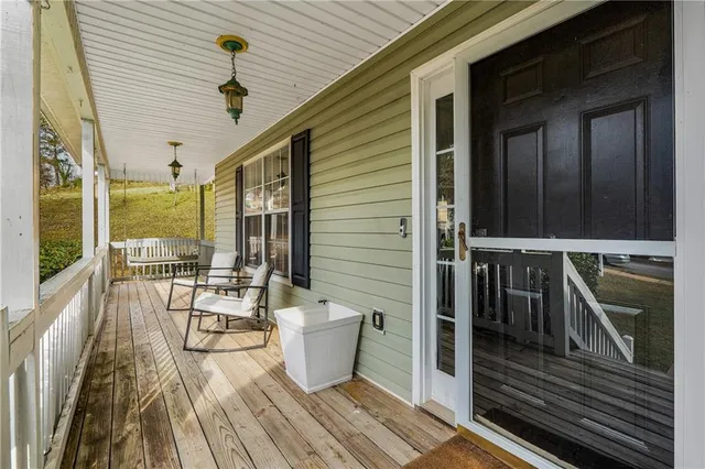 a balcony with wooden floor
