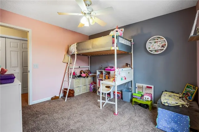 a bathroom with a toilet a sink and a mirror