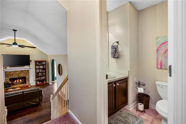a view of a hallway with wooden shelves