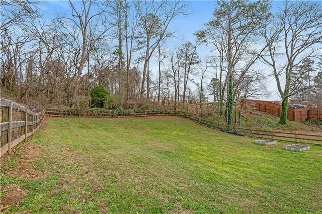 a view of a house with a big yard