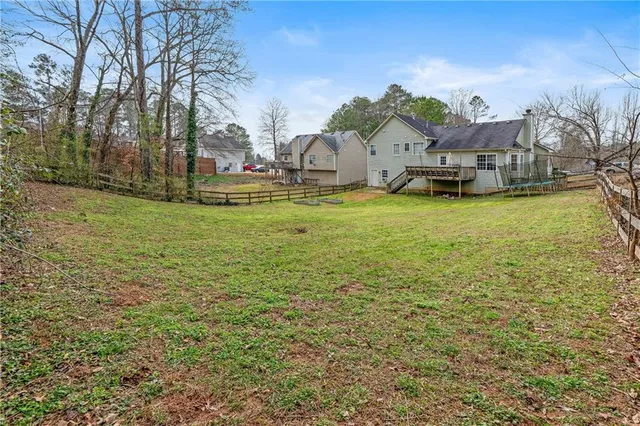 a living room with fireplace furniture and a flat screen tv