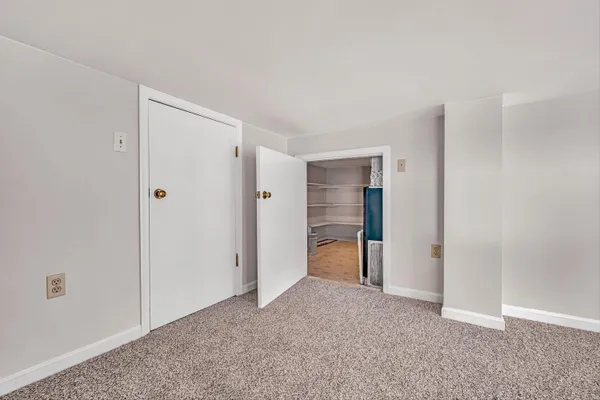 a view of a hallway with stairs