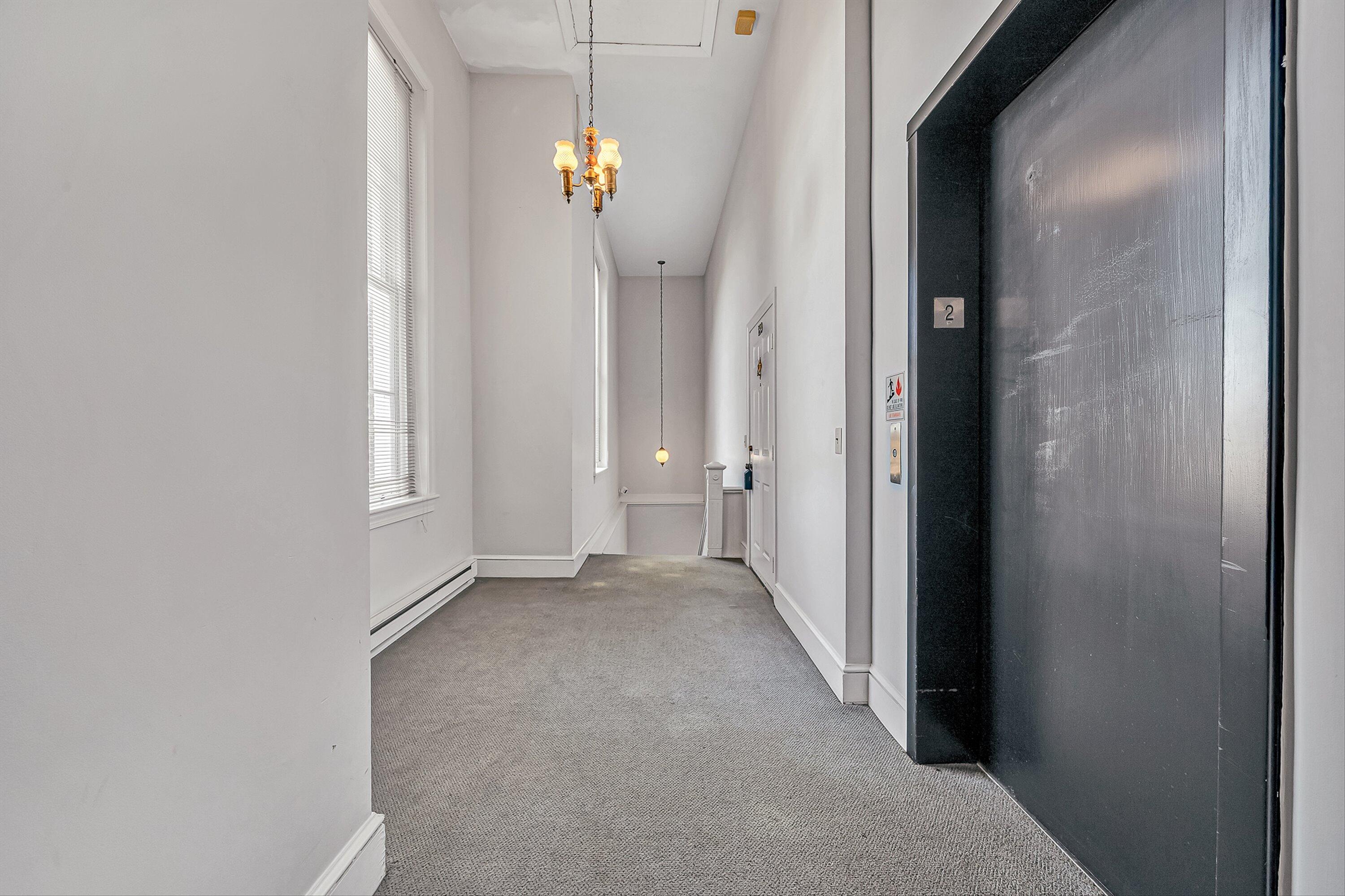 129 Academy Street Salem, VA 24153 - Photo 25 of 28 Hall view with elevator