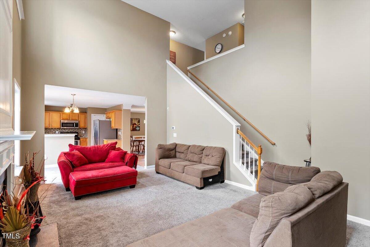 5121 Amberfield Way Raleigh, NC 27604 - Photo 16 of 27 a living room with furniture and a couch
