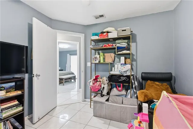 a living room with furniture and flat screen tv