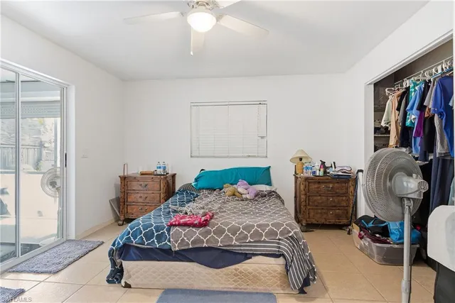 a bedroom with furniture and a closet