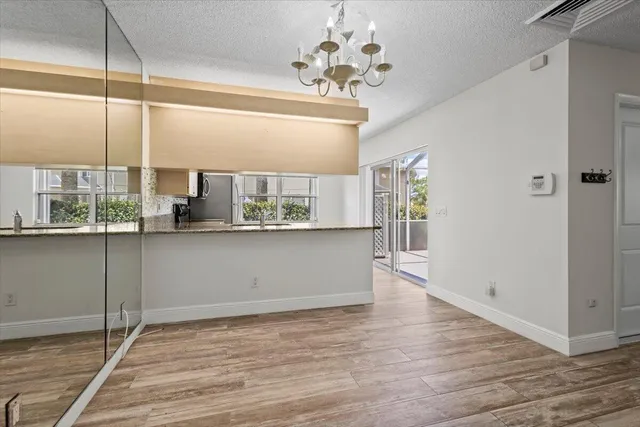 a view of a kitchen with a window and furniture