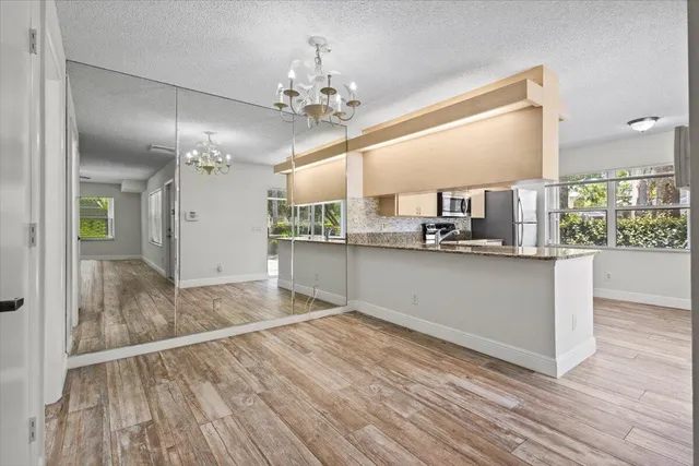 a view of a kitchen from the hallway