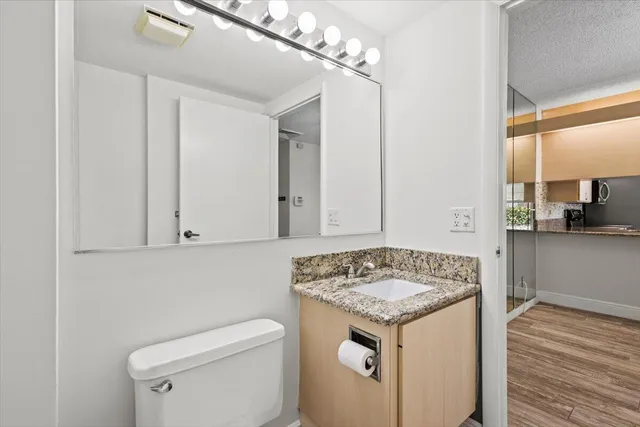 a view of bathroom with a sink and a toilet
