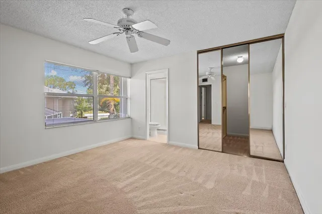 a view of livingroom with window ceiling fan and hardwood floor