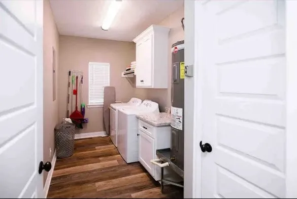 a hallway with a white stove top oven and furniture