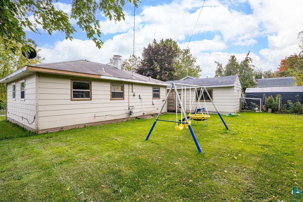 66 Banks Boulevard Silver Bay, MN 55614 - Photo 14 of 19 Rear view of house with a playground