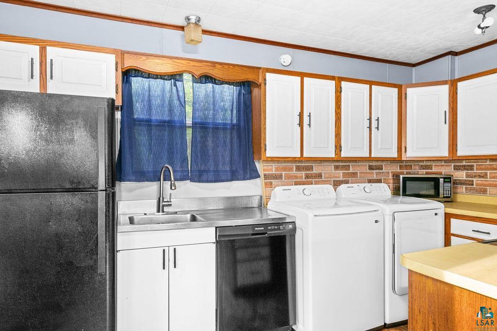 66 Banks Boulevard Silver Bay, MN 55614 - Photo 4 of 19 Laundry area featuring ornamental molding and washing machine and clothes dryer