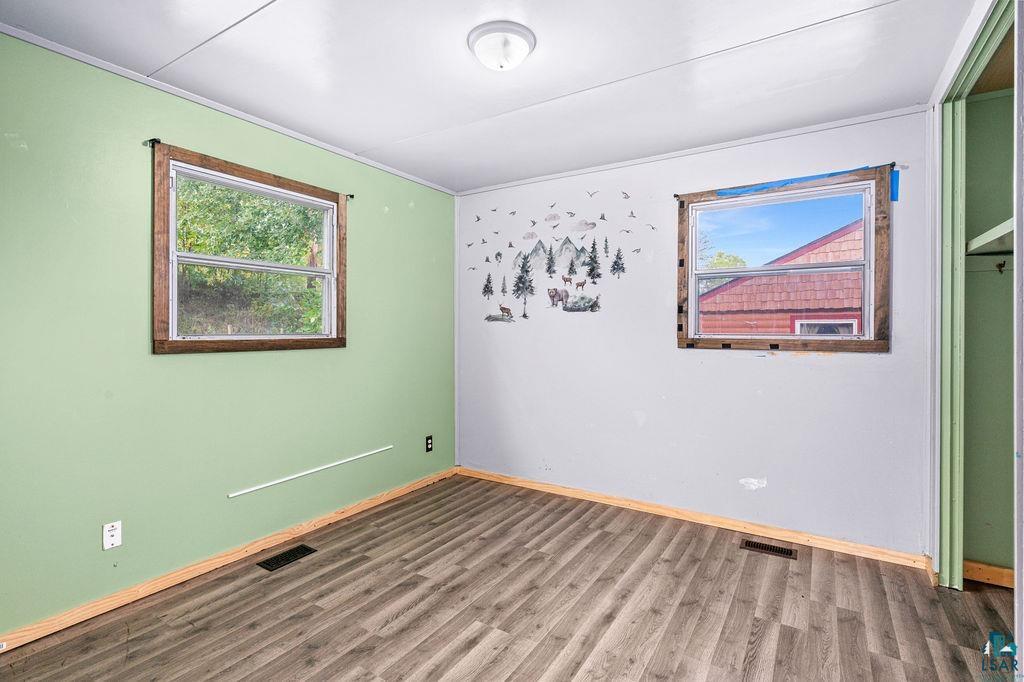 66 Banks Boulevard Silver Bay, MN 55614 - Photo 9 of 19 Empty room with wood finished floors