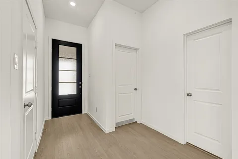 a view of an empty room and closet area