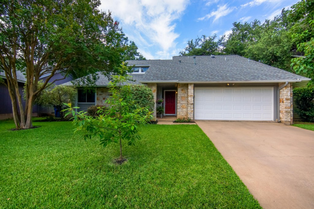 4617 Hawkhaven Lane Austin, TX 78727 - Photo 1 of 1 a front view of a house with a garden