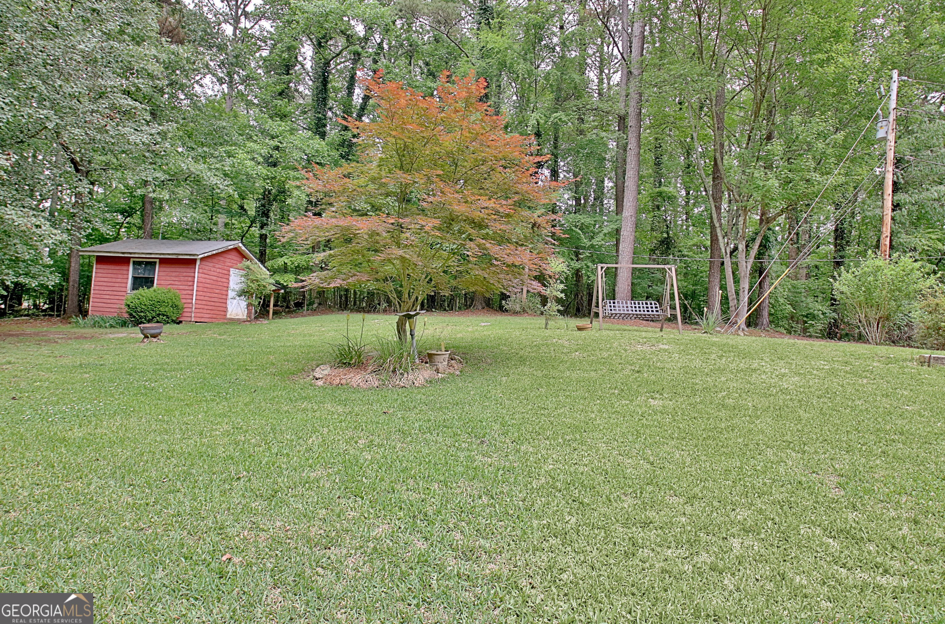 717 Tyrone Road Tyrone, GA 30290 - Photo 55 of 58 a view of a tree in front of a house