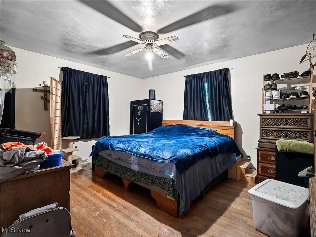 9049 Oberlin Road Elyria, OH 44035 - Photo 17 of 42 Bedroom featuring wood finished floors and a ceiling fan