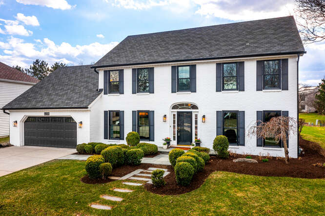 a backyard of a house with seating space