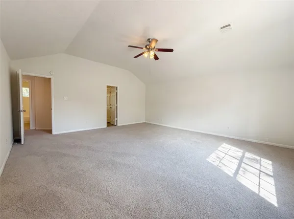 a view of empty room with windows