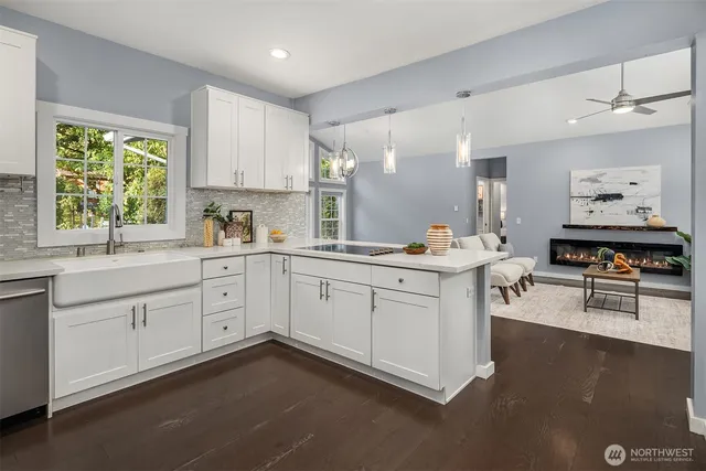 a kitchen with sink cabinets and window