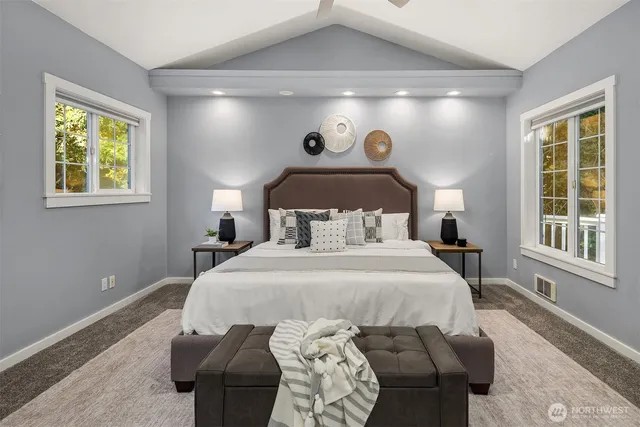 a bedroom with a bed and window