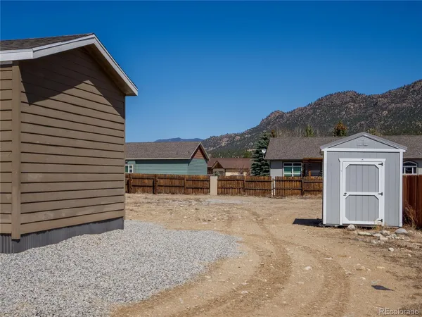 a view of a house with a backyard space