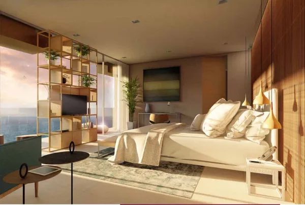 a bedroom with a bed and glass door