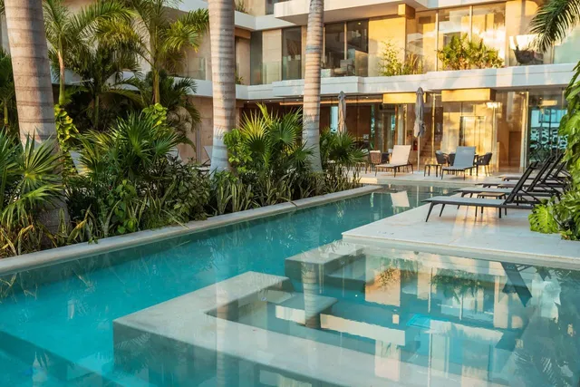 a view of pool with outdoor seating