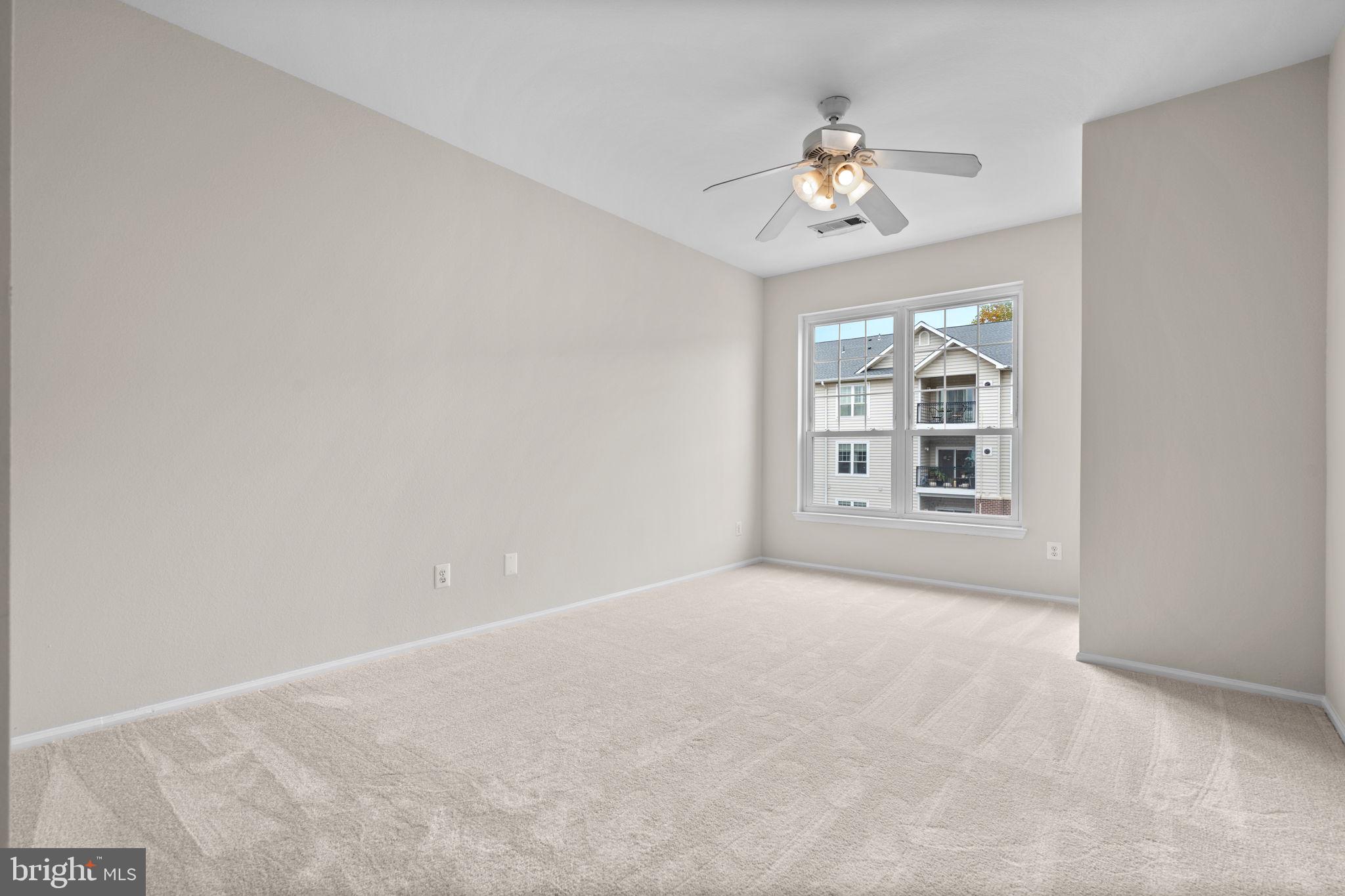 1570 Spring Gate Dr., Unit 7303 McLean, VA 22102 - Photo 14 of 25 a view of an empty room with a window