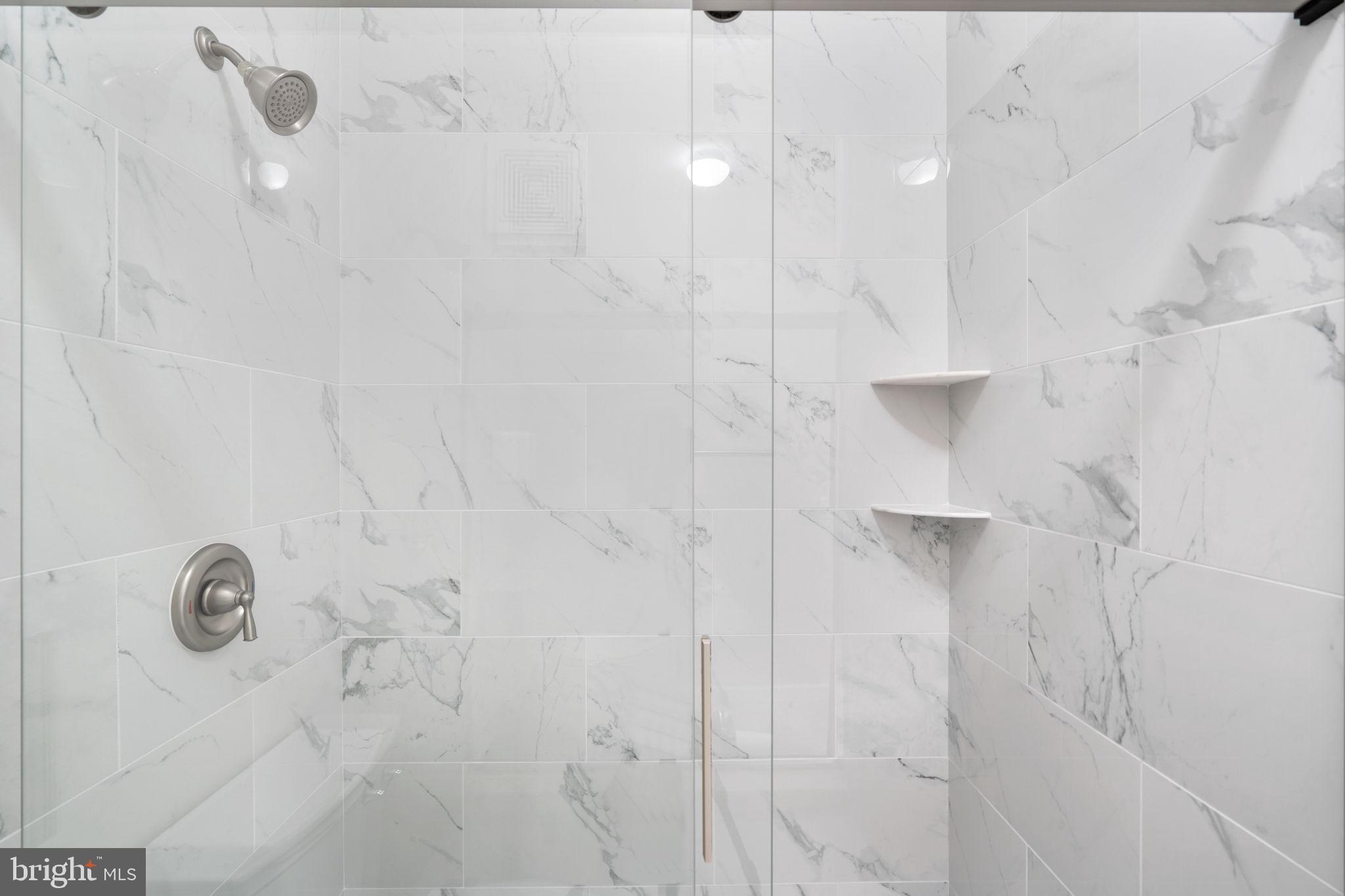 1570 Spring Gate Dr., Unit 7303 McLean, VA 22102 - Photo 17 of 25 a bathroom with a shower