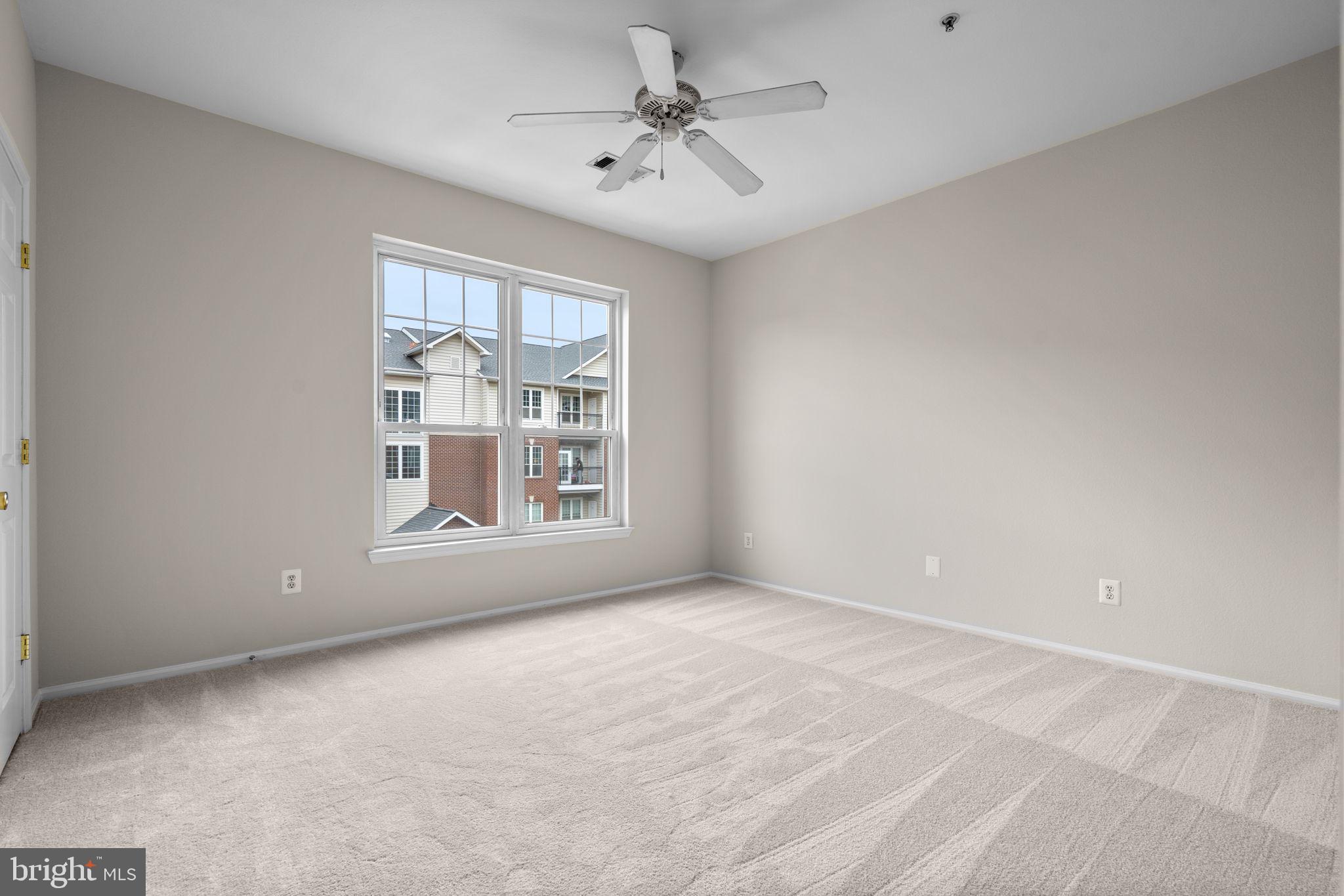 1570 Spring Gate Dr., Unit 7303 McLean, VA 22102 - Photo 19 of 25 a view of an empty room with a window