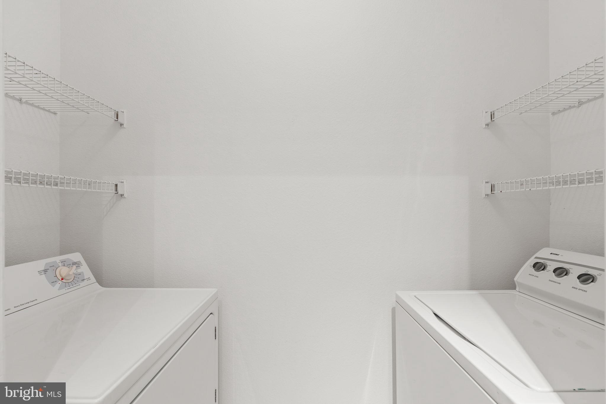 1570 Spring Gate Dr., Unit 7303 McLean, VA 22102 - Photo 23 of 25 a utility room with dryer and washer