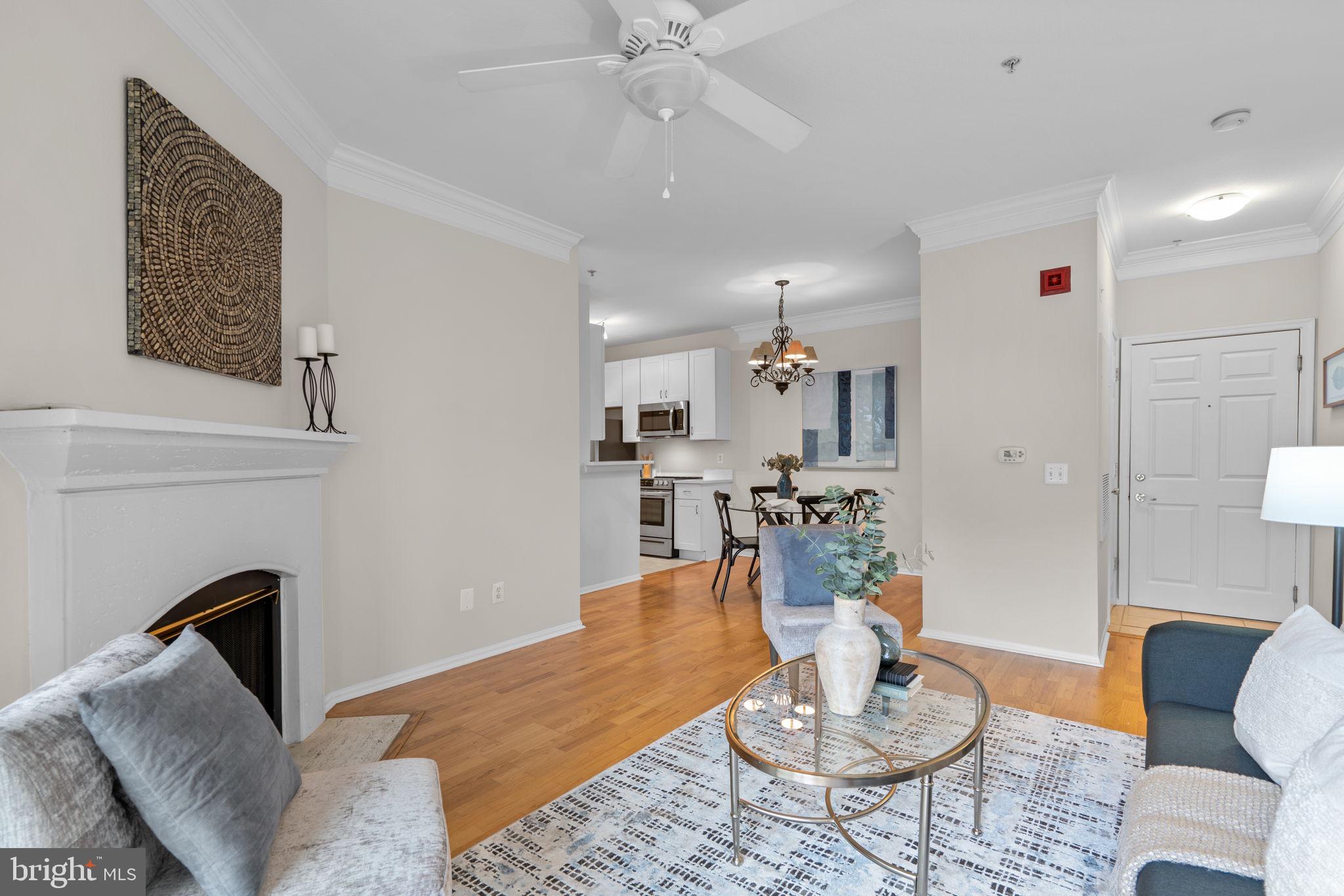 1570 Spring Gate Dr., Unit 7303 McLean, VA 22102 - Photo 6 of 25 a living room with furniture and a table