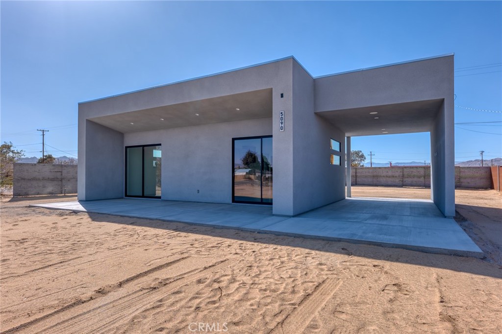 5090 1st Street East Joshua Tree, CA 92252 - Photo 1 of 12 a view of an entryway of a house
