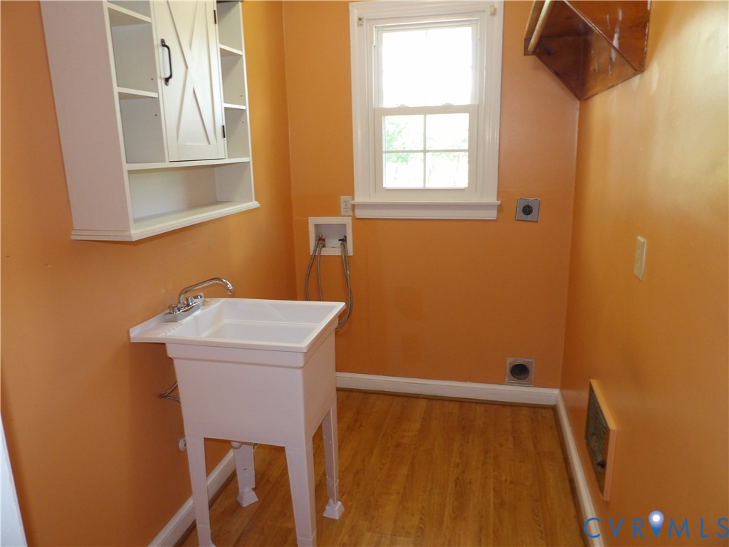 3813 Johnson Road Petersburg, VA 23805 - Photo 30 of 51 Utility sink with chrome-finish faucet, wall-mount