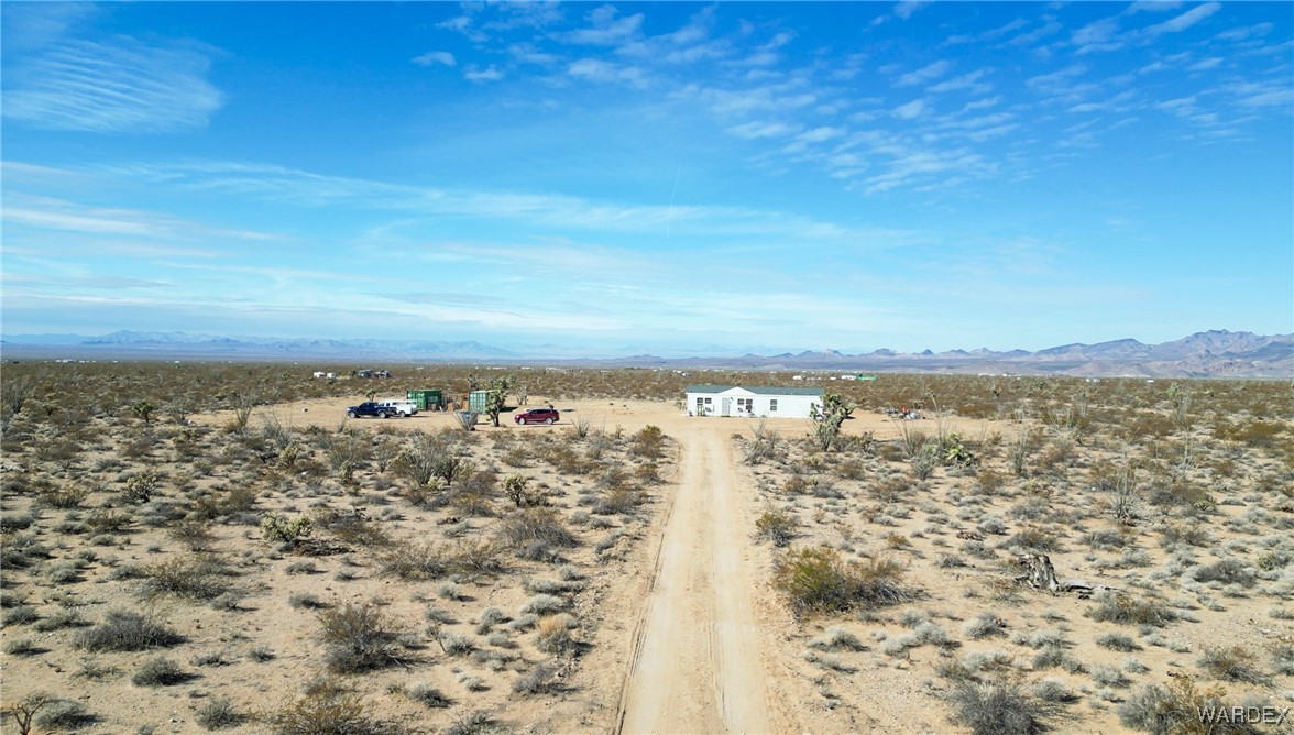 15333 South Doc Holliday Road Yucca, AZ 86438 - Photo 1 of 15 Birds eye view of property featuring a mountain view and a desert view