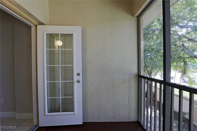 a view of front door and a window