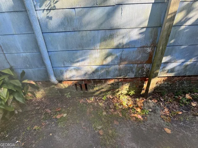 a view of hallway with furniture and windows