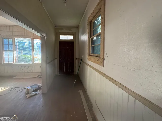 a view of livingroom with furniture and workspace