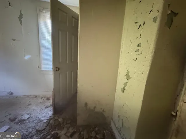 a view of a house with pool and sitting area