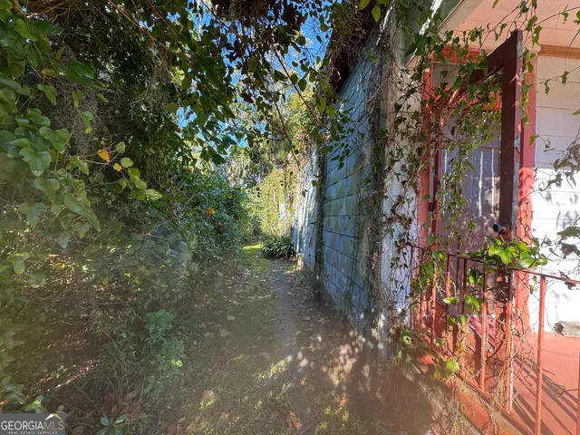 a backyard of a house with lots of green space