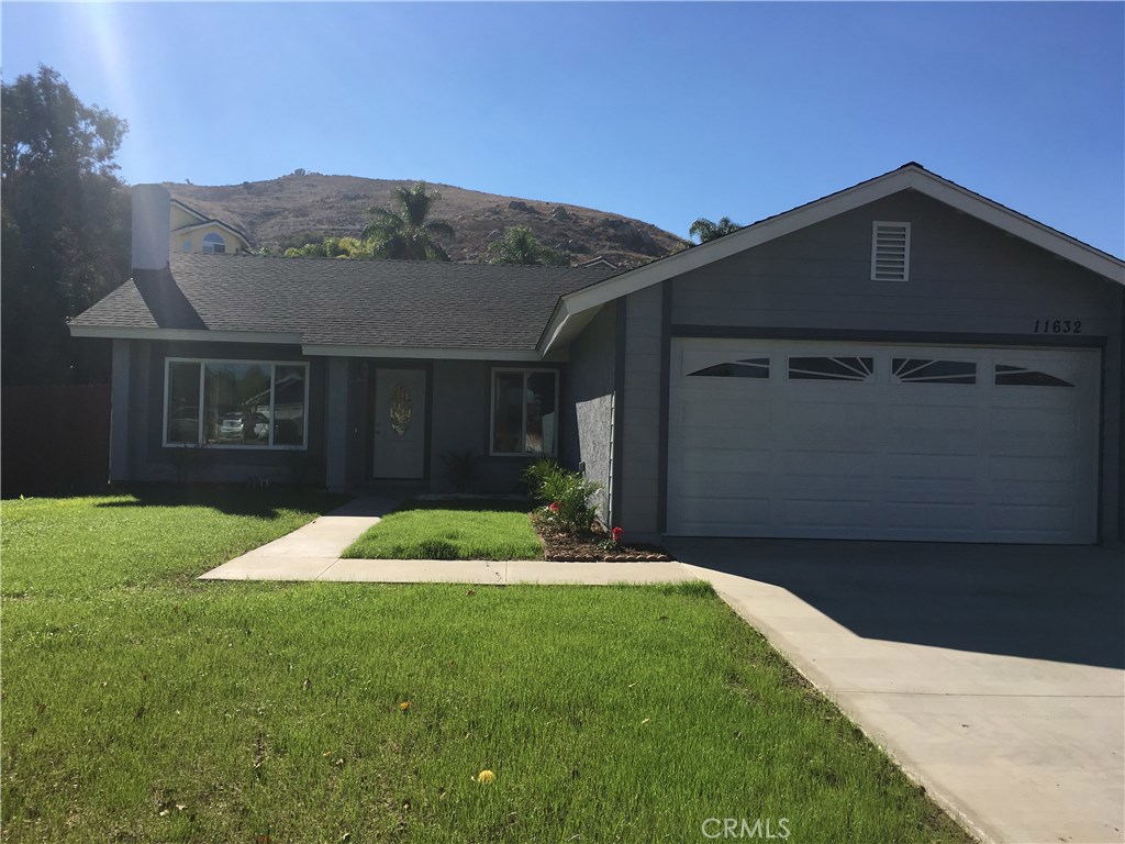 11632 Hartford Court Riverside, CA 92503 - Photo 1 of 1 a front view of a house with a yard
