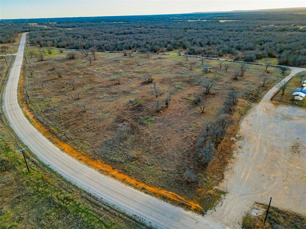Lot 40 Paradise Oaks Ranch Perrin, TX 76486 - Photo 3 of 12 a view of a lake with a mountain
