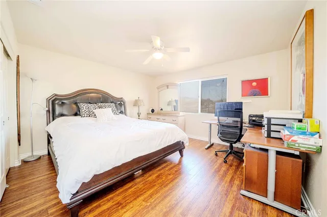 a bedroom with a bed and a table in it