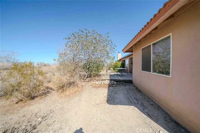 a view of a house with a snow in the background