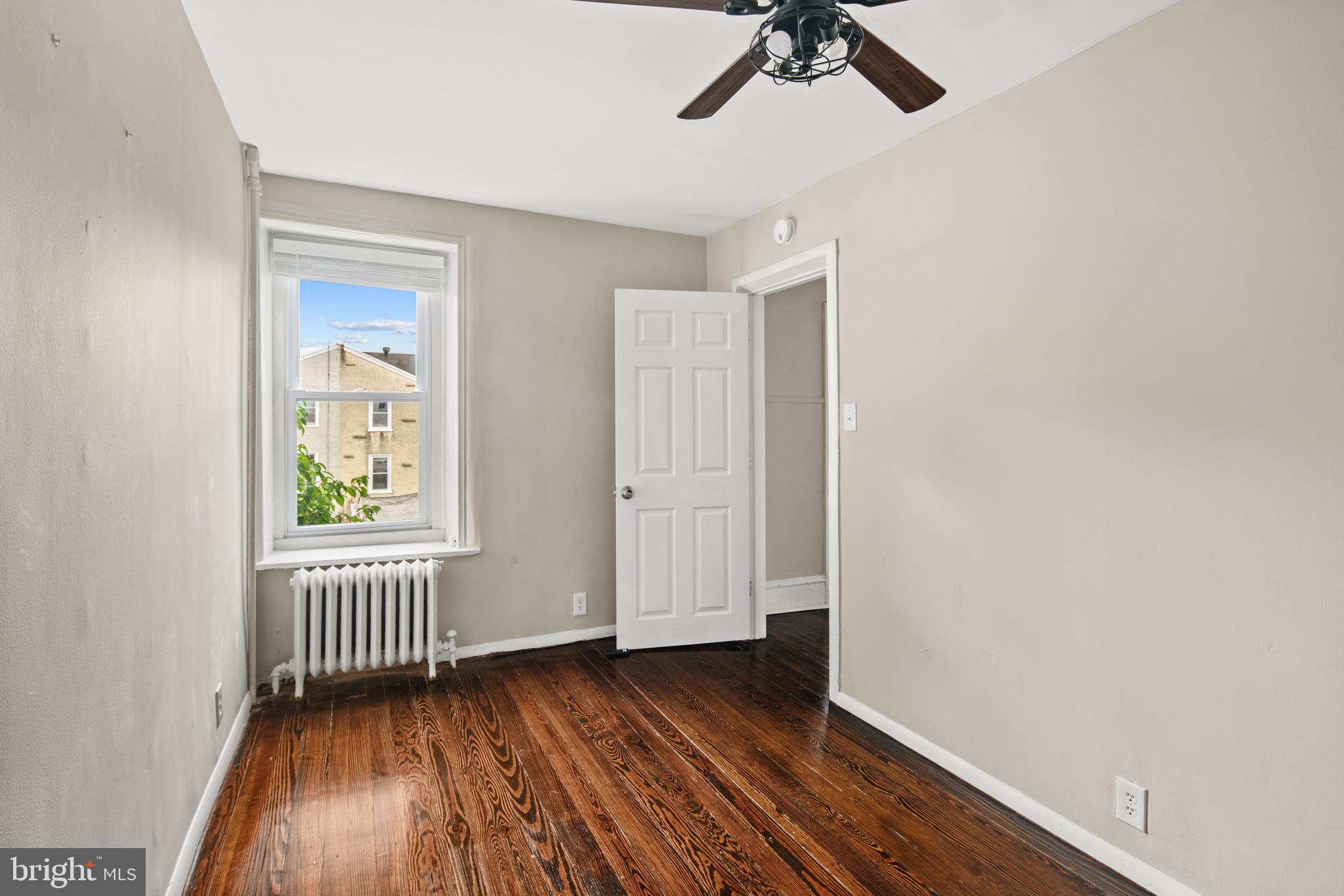 127 Seville Street Philadelphia, PA 19127 - Photo 15 of 23 wooden floor in an empty room with a window
