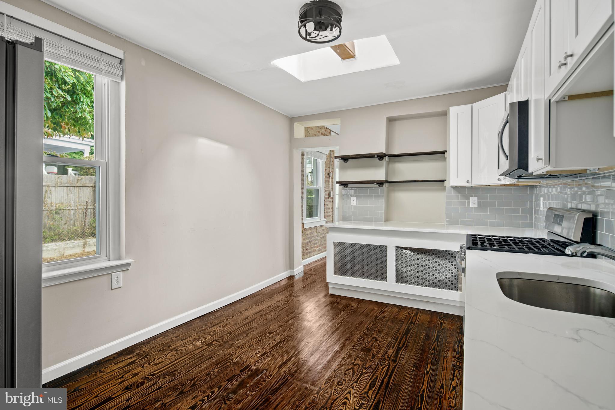 127 Seville Street Philadelphia, PA 19127 - Photo 4 of 23 a kitchen with a refrigerator and a sink