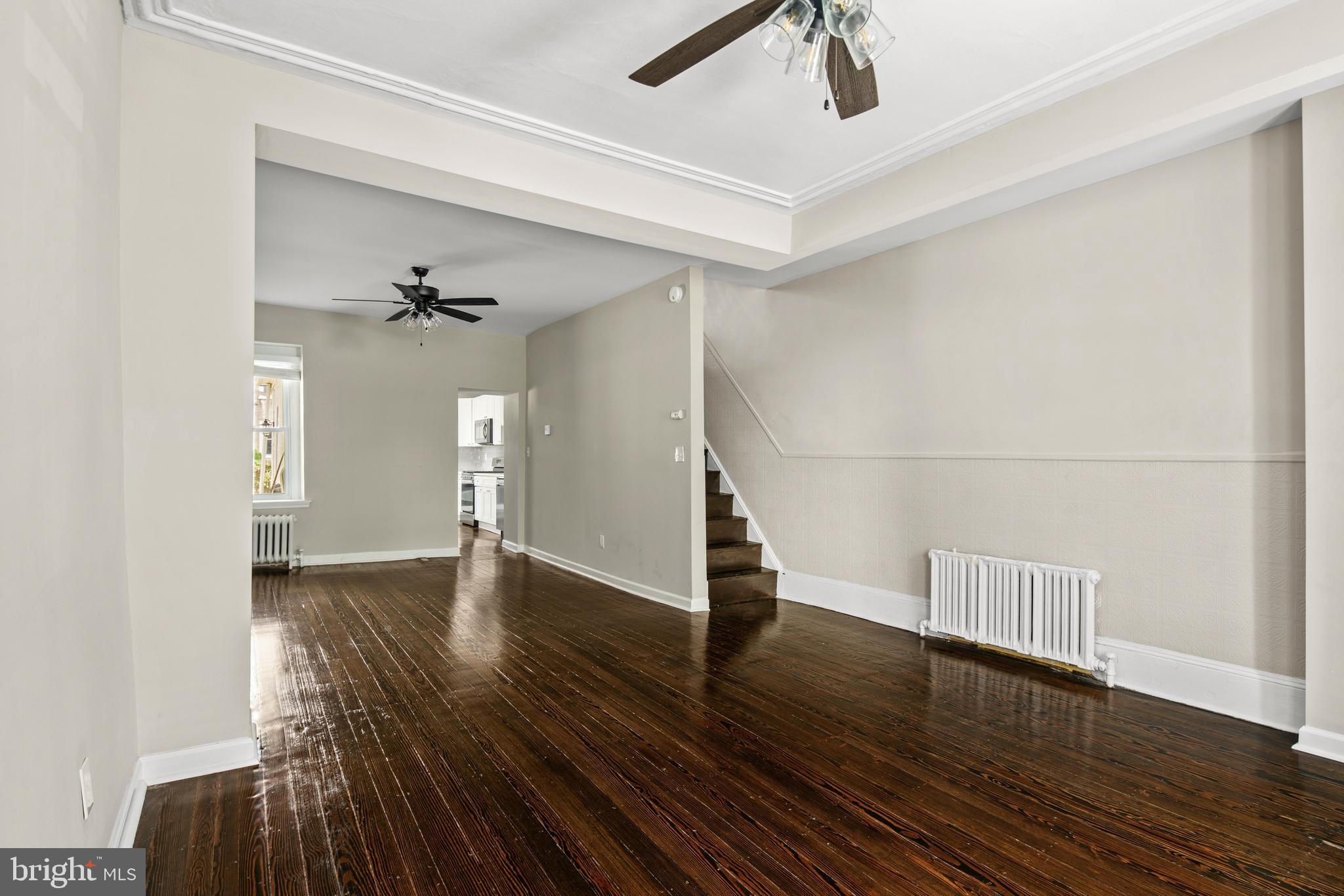 127 Seville Street Philadelphia, PA 19127 - Photo 5 of 23 a view of an empty room with wooden floor and a ceiling fan